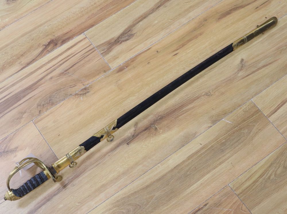 A Victorian officers sword, shagreen grip and 81cm curved, etched, single-edged blade, gilt metal scabbard, inscribed and personalised